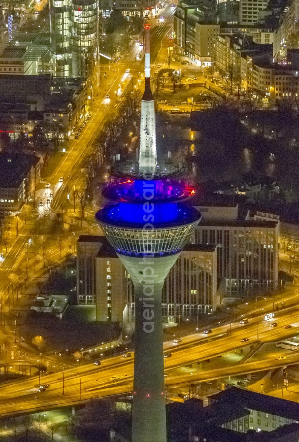 Düsseldorf at night from above - View of the telecommunications tower Rheinturm in Dusseldorf in the state North Rhine-Westhalia. The Rheinturm carries aerials for directional radio, FM and TV transmitters and DVB-T