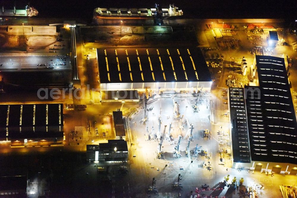 Aerial photograph at night Rostock - Night view company grounds and facilities of Liebherr-MCCtec GmbH in Rostock in the state Mecklenburg - Western Pomerania