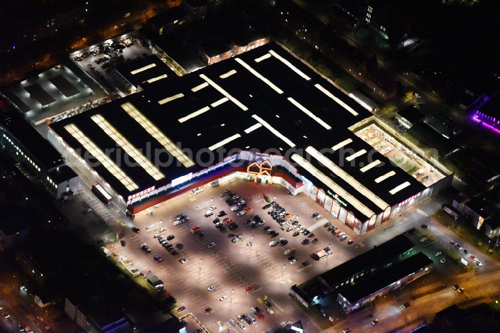 Lübeck at night from the bird perspective: Night view building of the construction market Bauhaus in the district Sankt Lorenz Nord in Luebeck in the state Schleswig-Holstein