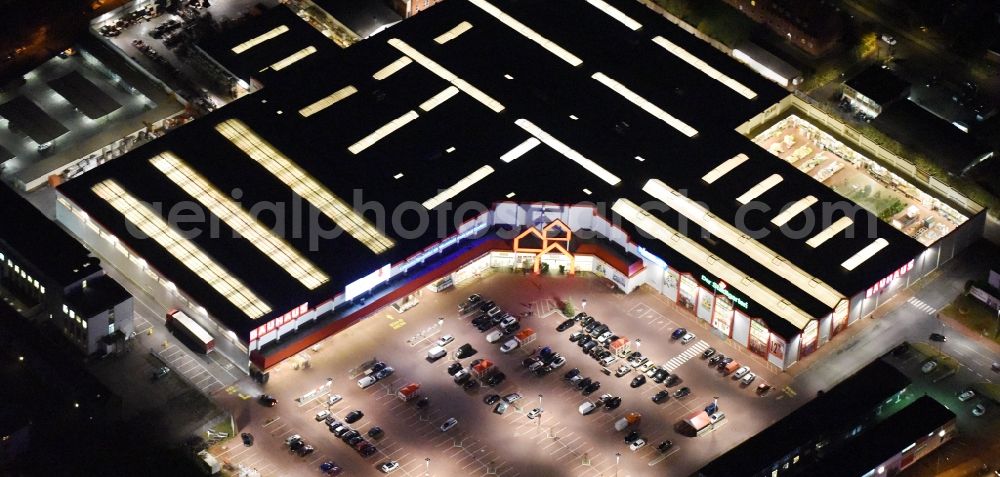 Aerial photograph at night Lübeck - Night view building of the construction market Bauhaus in the district Sankt Lorenz Nord in Luebeck in the state Schleswig-Holstein