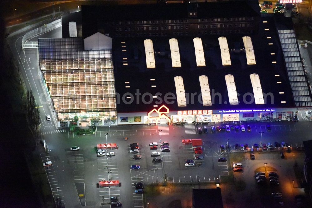 Berlin at night from above - Night view building of the construction market of Bauhaus AG in the Karlshorster street in the district Niederschoeneweide in Berlin