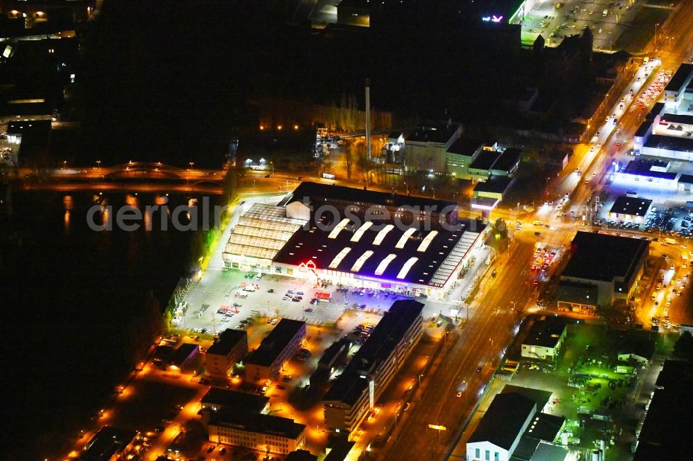 Berlin at night from above - Night lighting Building of the construction market Bauhaus Schnellerstrasse - federal road B96a - Karlshorster Strasse in the district Treptow in Berlin