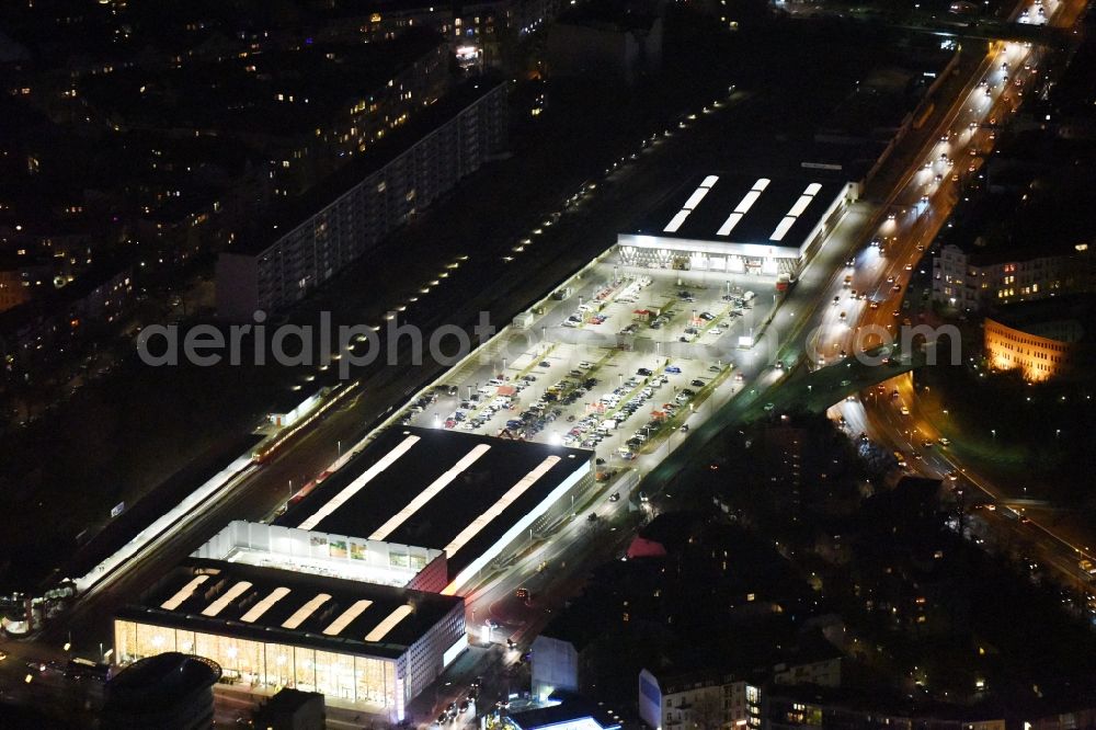 Aerial image at night Berlin - Night view building of the construction market of Bauhaus AG in the district Wilmersdorf in Berlin