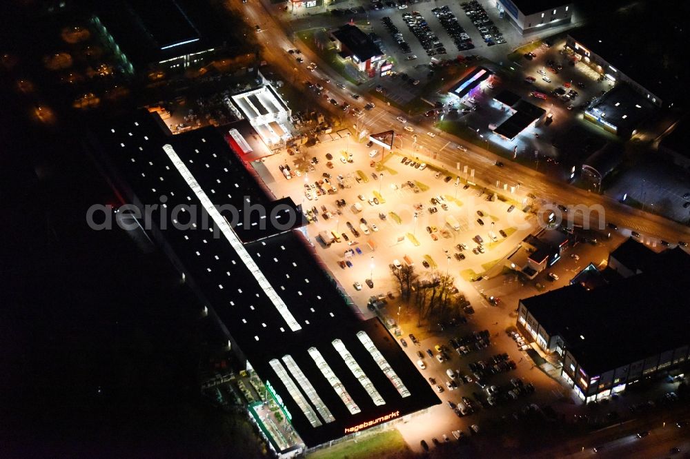 Lübeck at night from above - Night view building of the construction market of hagebaumarkt in Luebeck in the state Schleswig-Holstein