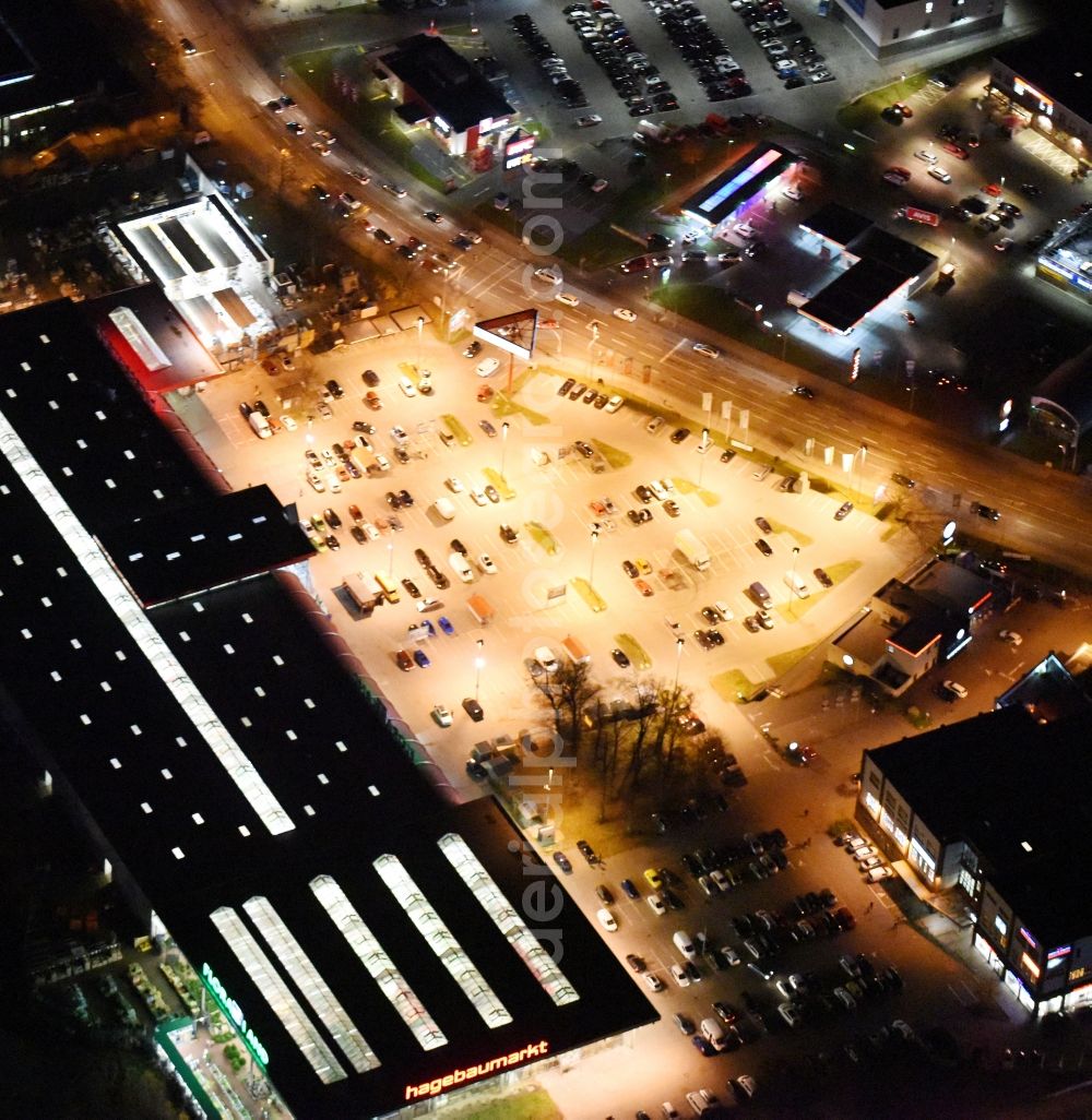 Lübeck at night from the bird perspective: Night view building of the construction market of hagebaumarkt in Luebeck in the state Schleswig-Holstein