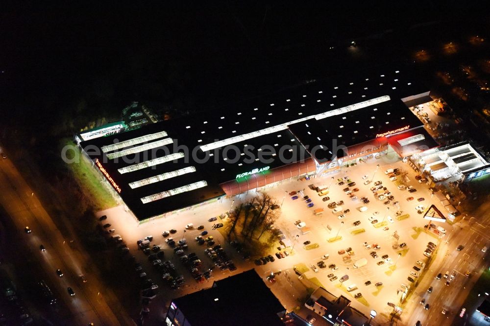 Aerial image at night Lübeck - Night view building of the construction market of hagebaumarkt in Luebeck in the state Schleswig-Holstein