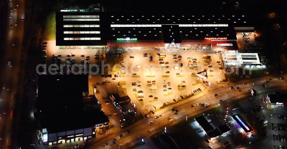 Aerial photograph at night Lübeck - Night view building of the construction market of hagebaumarkt in Luebeck in the state Schleswig-Holstein