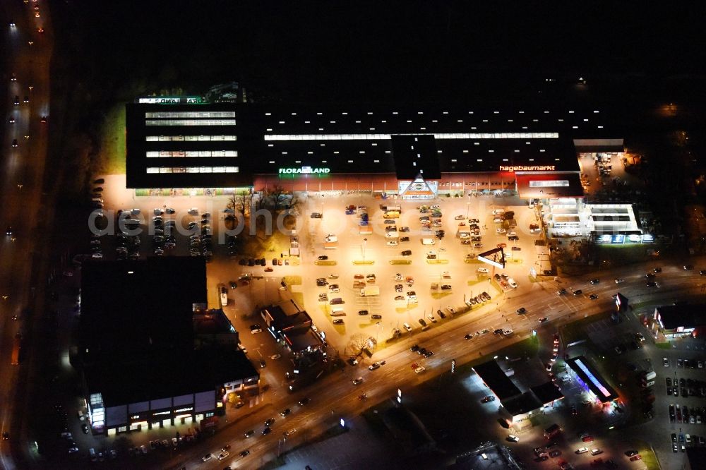 Aerial image at night Lübeck - Night view building of the construction market of hagebaumarkt in Luebeck in the state Schleswig-Holstein