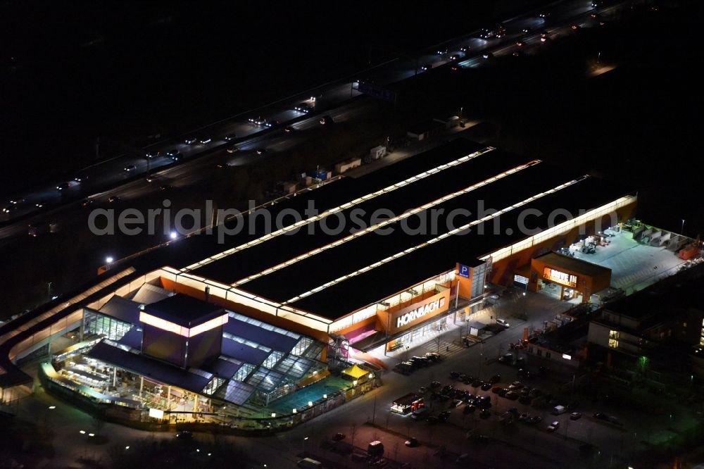 Aerial image at night München - Night Aerial view of the building of the construction market of Hornbach Munich Froettmaning with Drive-In for building materials in Munich in Bavaria