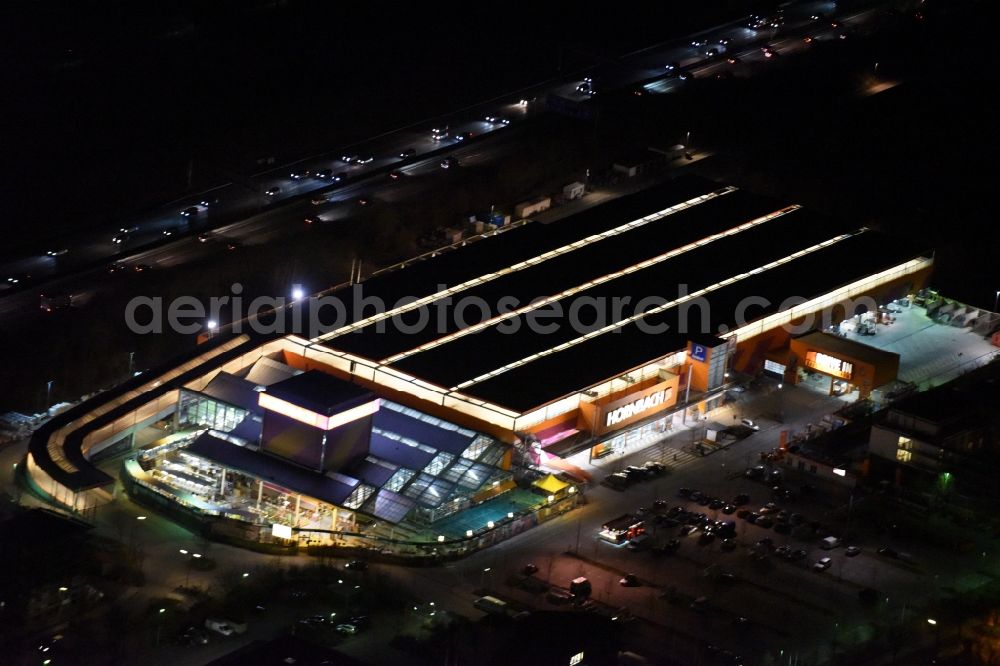 München at night from above - Night Aerial view of the building of the construction market of Hornbach Munich Froettmaning with Drive-In for building materials in Munich in Bavaria