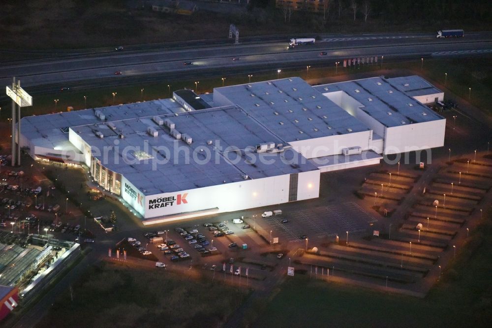 Aerial image at night Fredersdorf-Vogelsdorf - Night view building of the store - furniture market Moebel Kraft GmbH & Co. KG in Fredersdorf-Vogelsdorf in the state Brandenburg