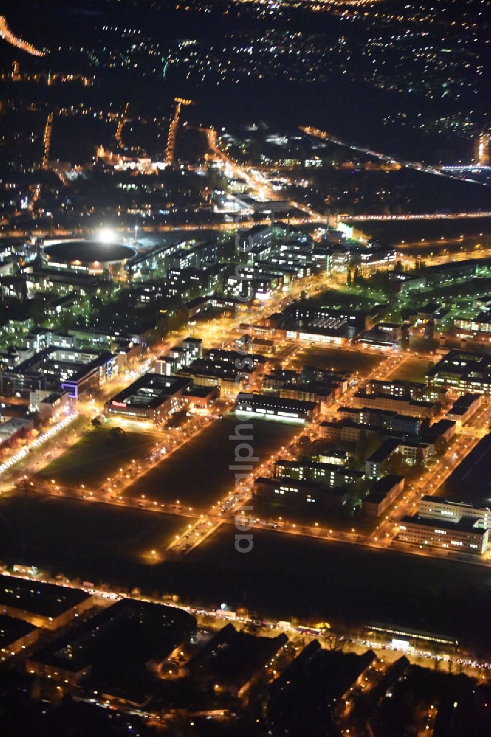 Berlin at night from the bird perspective: Night aerial view on the industrial estate and company settlement at the Rudower Chaussee in the Adlershof district of Berlin in Germany