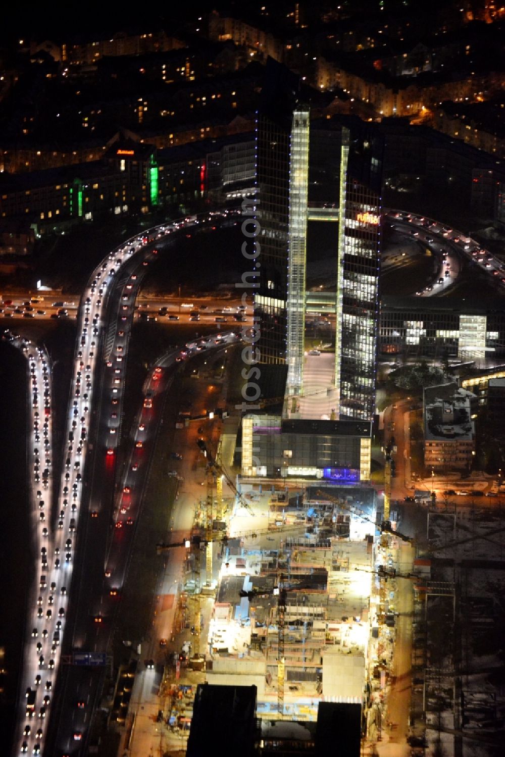 München at night from the bird perspective: Night view of „ HighLight Towers “ office building in Munich