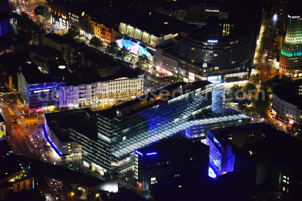 Aerial photograph at night Berlin - Night aerial view of the illuminated Kranzler Eck building at the intersection between Joachimstalerstrasse and Kurfürstendamm in Berlin Charlottenburg. The imposing light installations are part of the annual Festival of Lights event