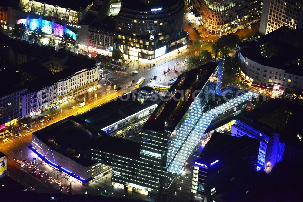 Aerial image at night Berlin - Night aerial view of the illuminated Kranzler Eck building at the intersection between Joachimstalerstrasse and Kurfürstendamm in Berlin Charlottenburg. The imposing light installations are part of the annual Festival of Lights event