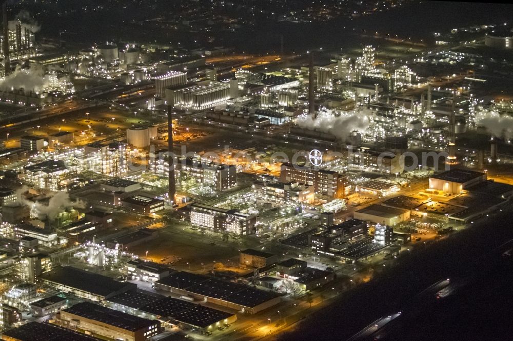 Dormagen at night from the bird perspective: Night aerial view of industrial site Chempark (formerly Bayer Dormagen or Dormagen site) in Dormagen, in North Rhine-Westphalia