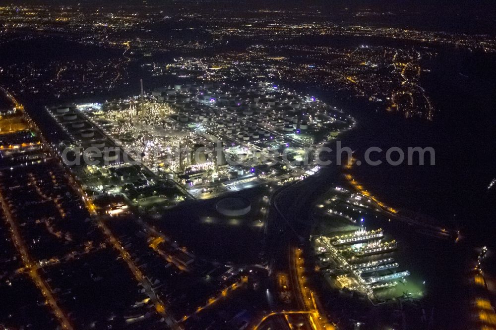 Köln Godorf at night from the bird perspective: Night aerial view of the industrial area of the German Rhineland refinery Godorf Shell AG in Cologne in North Rhine-Westphalia