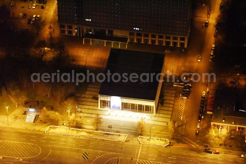 Aerial photograph at night Berlin - Night view building of the movie theater cinema international by the yorck cinema group at the Karl Marx Allee in Berlin