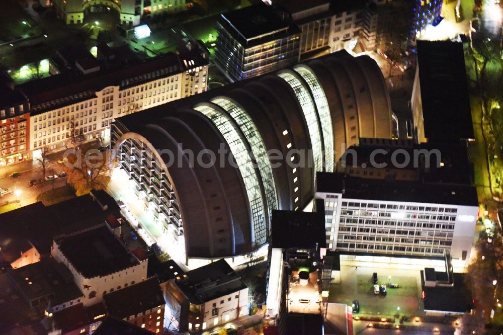 Berlin at night from the bird perspective: Night view of the Ludwig-Erhard-Haus (commonly known as Armadillo), the seat of the Berlin Stock Exchange and the Chamber of Commerce's (ICC). The building was constructed by Nicholas Grimshaw and Partners. It is located Fasanenstrasse in Berlin's Charlottenburg