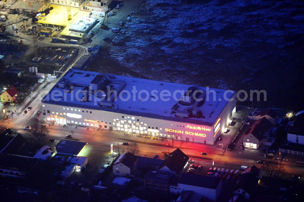 Karlsfeld at night from the bird perspective: Night aerial view of the construction site of the shopping center Karlsfeld in Munich in Bavaria