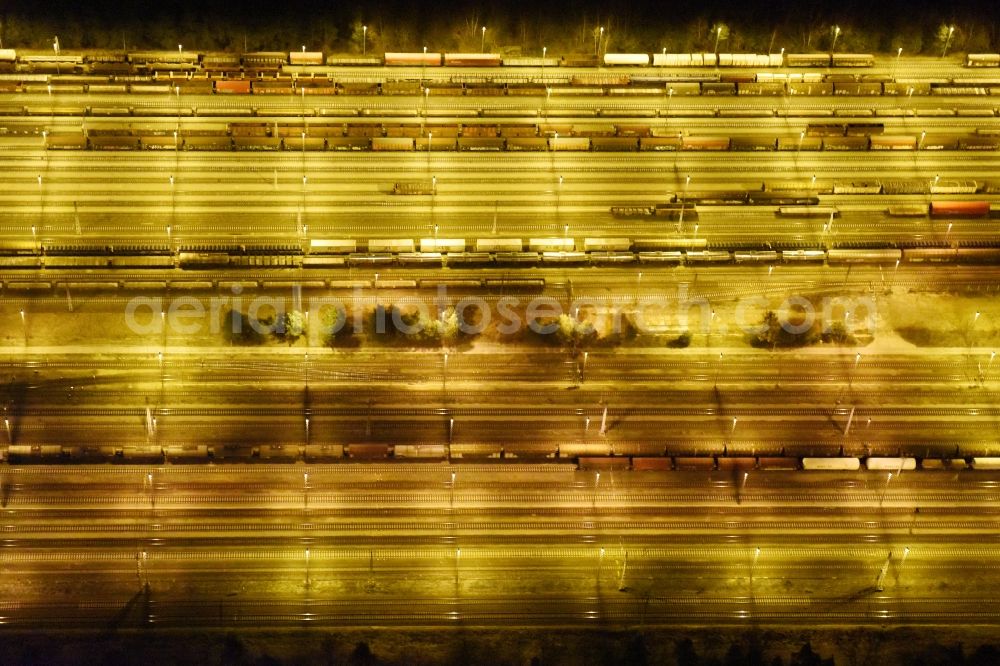 Aerial image at night Neuseddin - Night view marshalling yard and freight station of the Deutsche Bahn in Neuseddin in the state Brandenburg