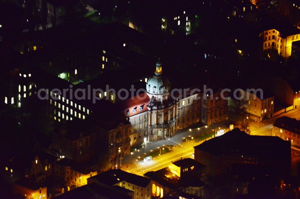 Potsdam at night from the bird perspective: Night aerial photo of the town hall in Potsdam in the state Brandenburg