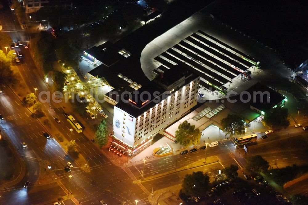 Aerial photograph at night Berlin - Night view road over the crossroads Masurenallee - Messedamm opposite the exhibition centre ICC in Berlin . In the picture the ibis hotel and the central bus station ZOB Messe north