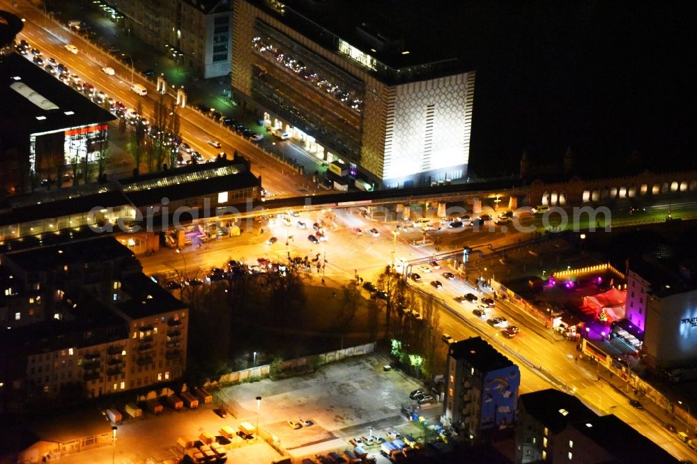 Aerial image at night Berlin - Night view road over the crossroads Stralauer Allee - Warschauer Strasse near the Oberbaum bridge and universal music in Berlin