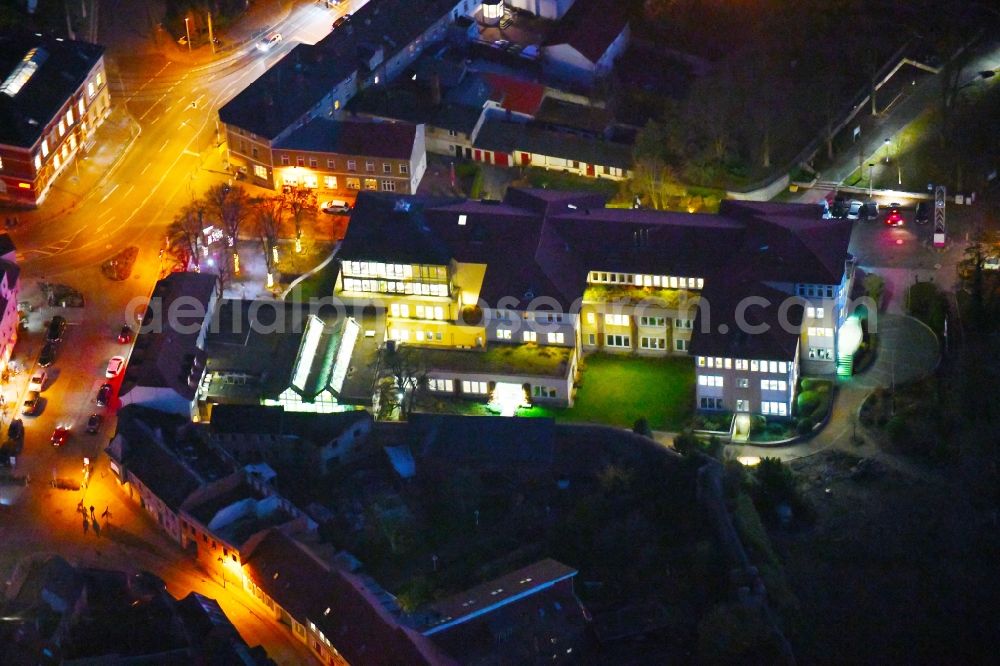 Strausberg at night from above - Night lighting Banking administration building of the financial services company Sparkasse on Karl-Liebknecht-Strasse coner Grosse Strasse in Strausberg in the state Brandenburg, Germany