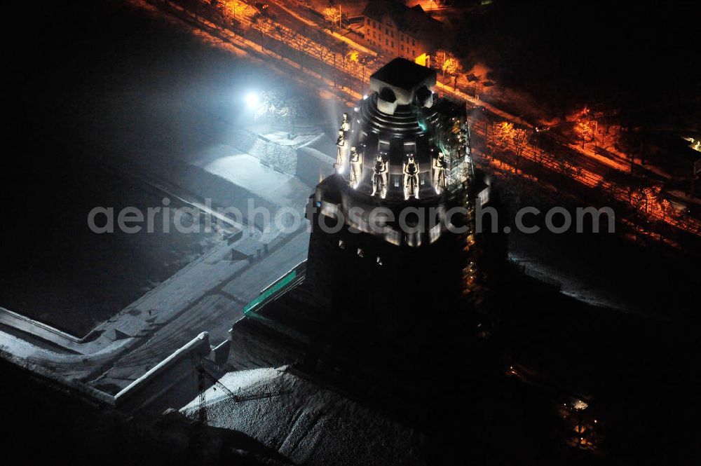 Aerial photograph at night Leipzig - Nachtluftbild vom Völkerschlachtdenkmal - winterlich mit Schnee bedeckt. Night aerial view of the Battle Monument Leipzig.