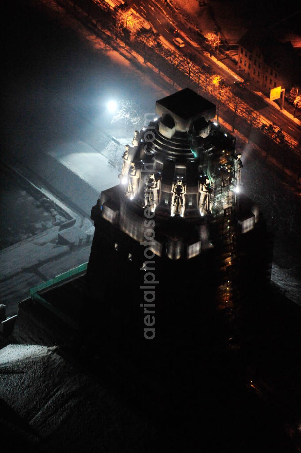 Aerial image at night Leipzig - Nachtluftbild vom Völkerschlachtdenkmal - winterlich mit Schnee bedeckt. Night aerial view of the Battle Monument Leipzig.