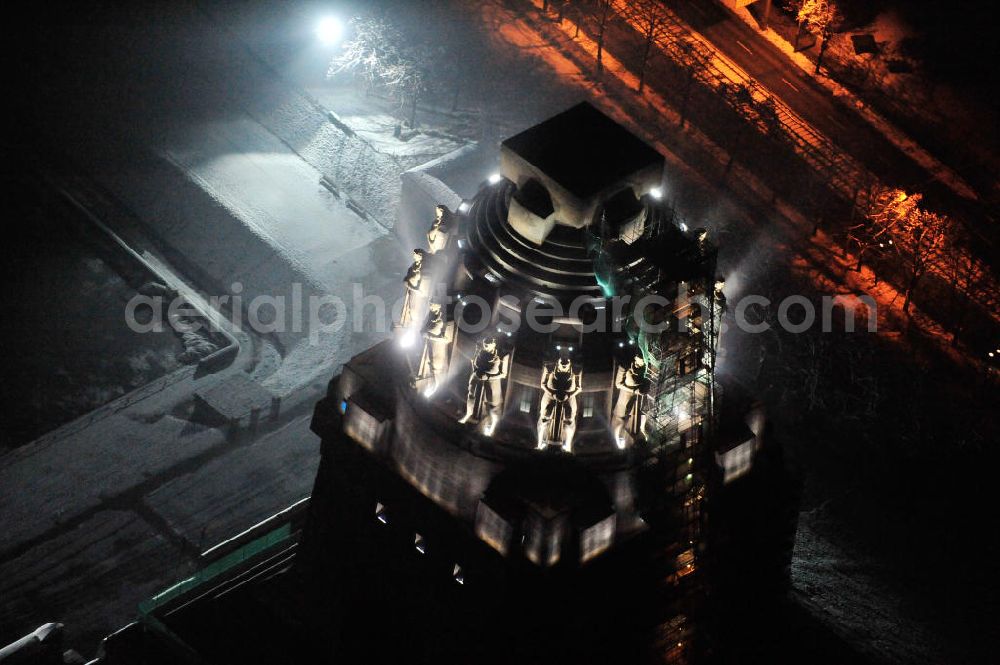 Leipzig at night from the bird perspective: Nachtluftbild vom Völkerschlachtdenkmal - winterlich mit Schnee bedeckt. Night aerial view of the Battle Monument Leipzig.