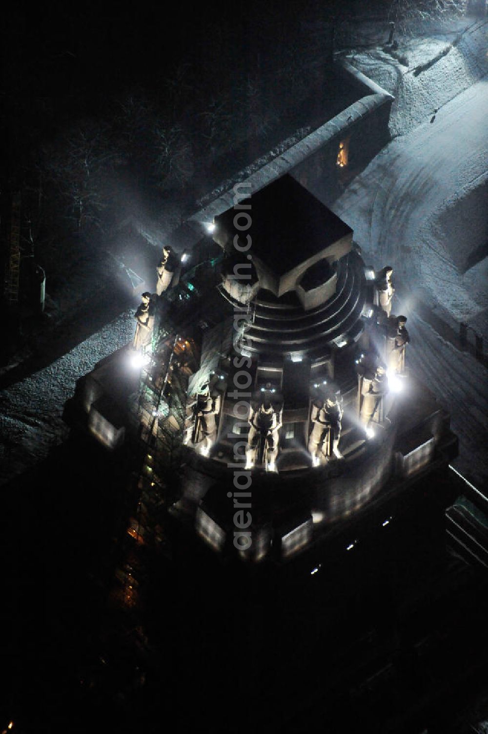 Leipzig at night from the bird perspective: Nachtluftbild vom Völkerschlachtdenkmal - winterlich mit Schnee bedeckt. Night aerial view of the Battle Monument Leipzig.