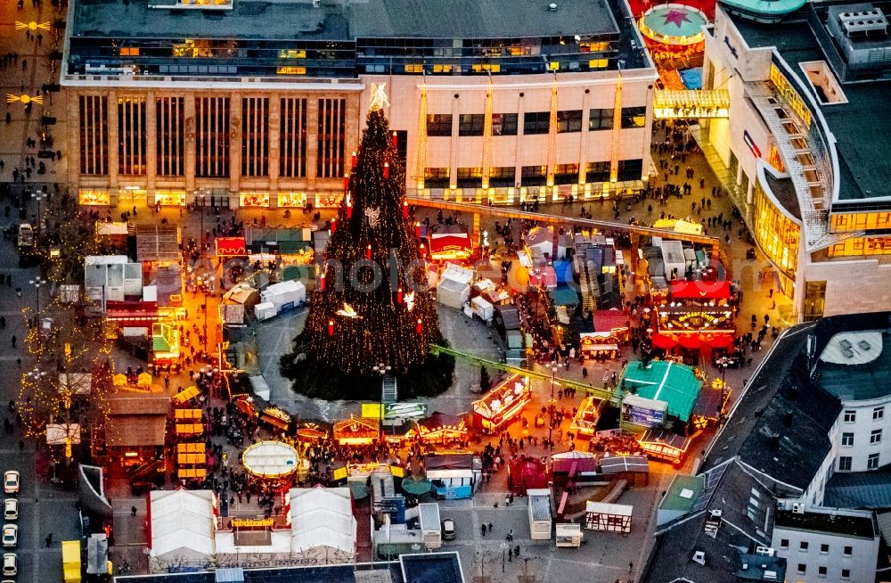 Dortmund at night from the bird perspective: Night aerial view from the Christmas market at the Hansa square with the big Christmas Tree in the city of Dortmund in North Rhine-Westphalia