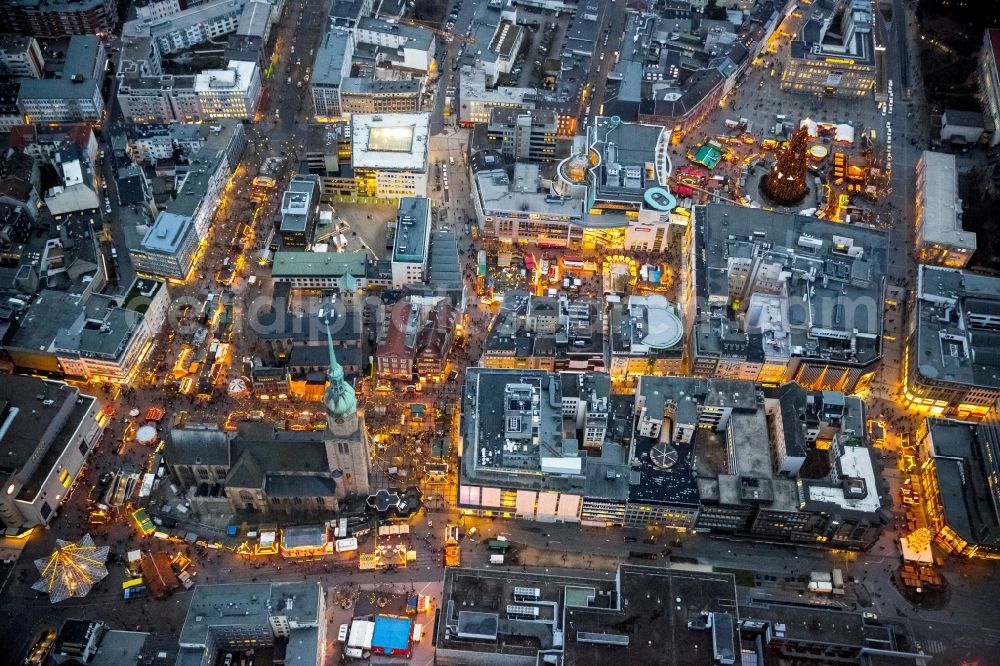 Dortmund at night from the bird perspective: Night aerial view from the Christmas market at the Hansa square with the big Christmas Tree in the city of Dortmund in North Rhine-Westphalia