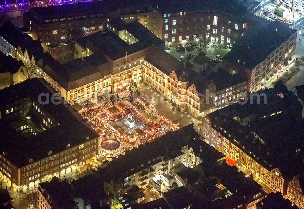 Düsseldorf at night from above - Night aerial view of the Christmas Market on Jan Wellem monument in the town square at the city hall in Dusseldorf in North Rhine-Westphalia