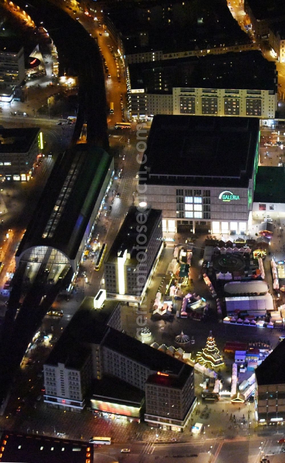 Berlin at night from above - Night view christmassy market event grounds and sale huts and booths auf dem Alexanderplatz in Berlin