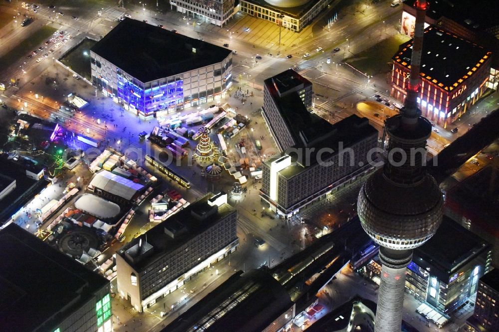 Berlin at night from above - Night view christmassy market event grounds and sale huts and booths auf dem Alexanderplatz in Berlin