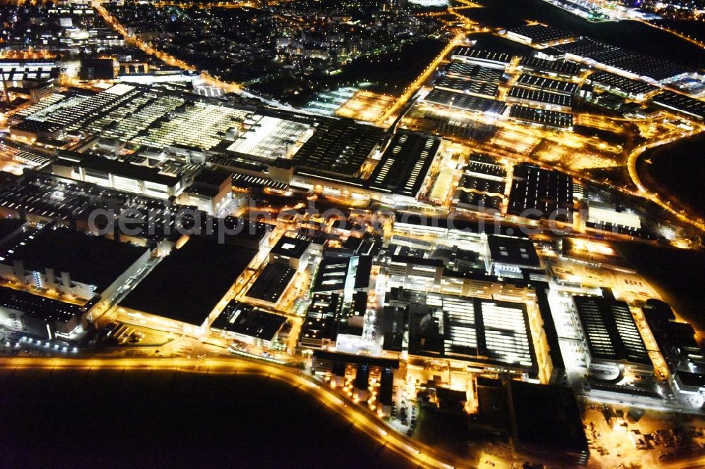 Ingolstadt at night from the bird perspective: Night view Building and production halls on the premises of AUDI AG on Ettinger Strasse in Ingolstadt in the state Bavaria