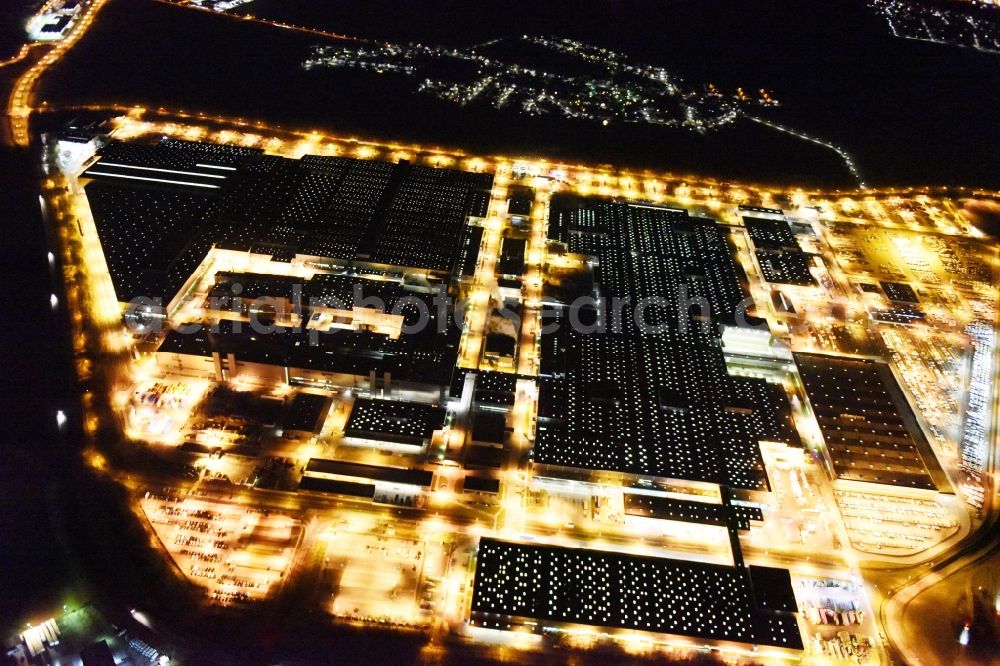 Ingolstadt at night from the bird perspective: Night view Building and production halls on the premises of AUDI AG on Ettinger Strasse in Ingolstadt in the state Bavaria