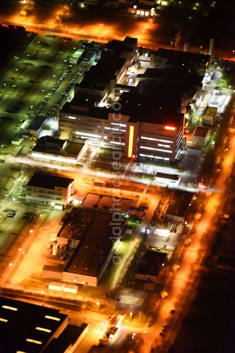 Regensburg at night from the bird perspective: Night view of factory premises of the company OSRAM Opto Semiconductors GmbH in Regensburg in the state Bavaria