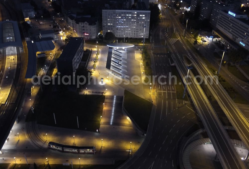 Halle (Saale) at night from the bird perspective: Night aerial view from the ZOB central bus station at the roundabout at the intersection Riebeckplatz in Halle (Saale) in Saxony-Anhalt