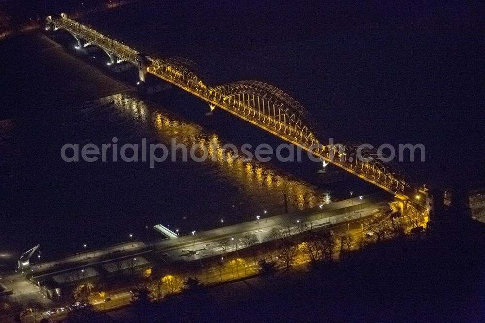 Aerial photograph at night KÖLN - Night aerial view of the arches of the South Bridge of the Rhine bridges over the Rhine in Cologne, in the state of North Rhine-Westphalia