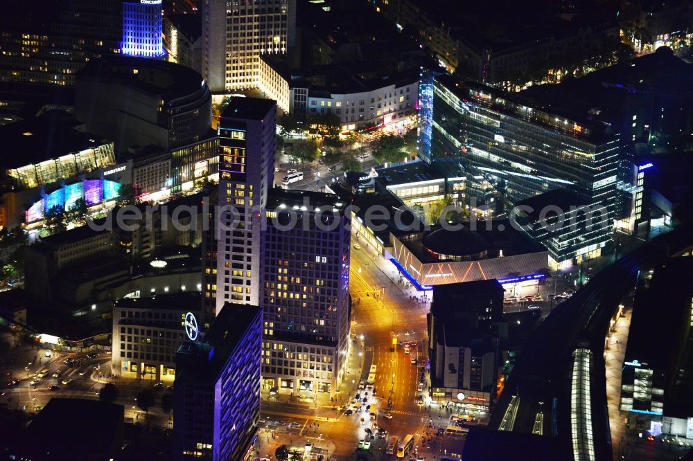 Aerial photograph at night Berlin - Night Aerial view of illuminated buildings at Zoologischer Garten station in the City West in Berlin-Charlottenburg. Visible mong others is the high-rise Zoofenster with the first Waldorf Astoria Hotel in Germany. The light installations are part of the annual Festival Of Lights. Warning: Commercial use can only be realized upon prior request at euroluftbild.de