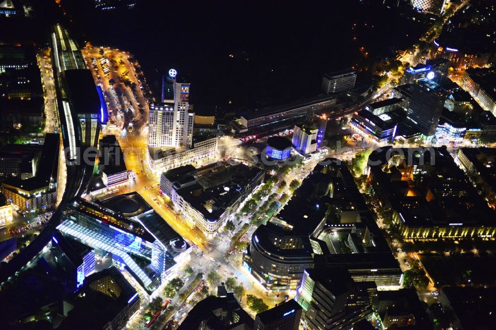 Aerial photograph at night Berlin - Night aerial view of illuminated buildings in the City West during the Festival of Light in Berlin Charlottenburg. The impressive installations of the annual event immerse the commercial and residential space along the Kurfuerstendamm in colorful lights. Part of the attractions are among others the Neues Kranzler Eck and the Breitscheidplatz