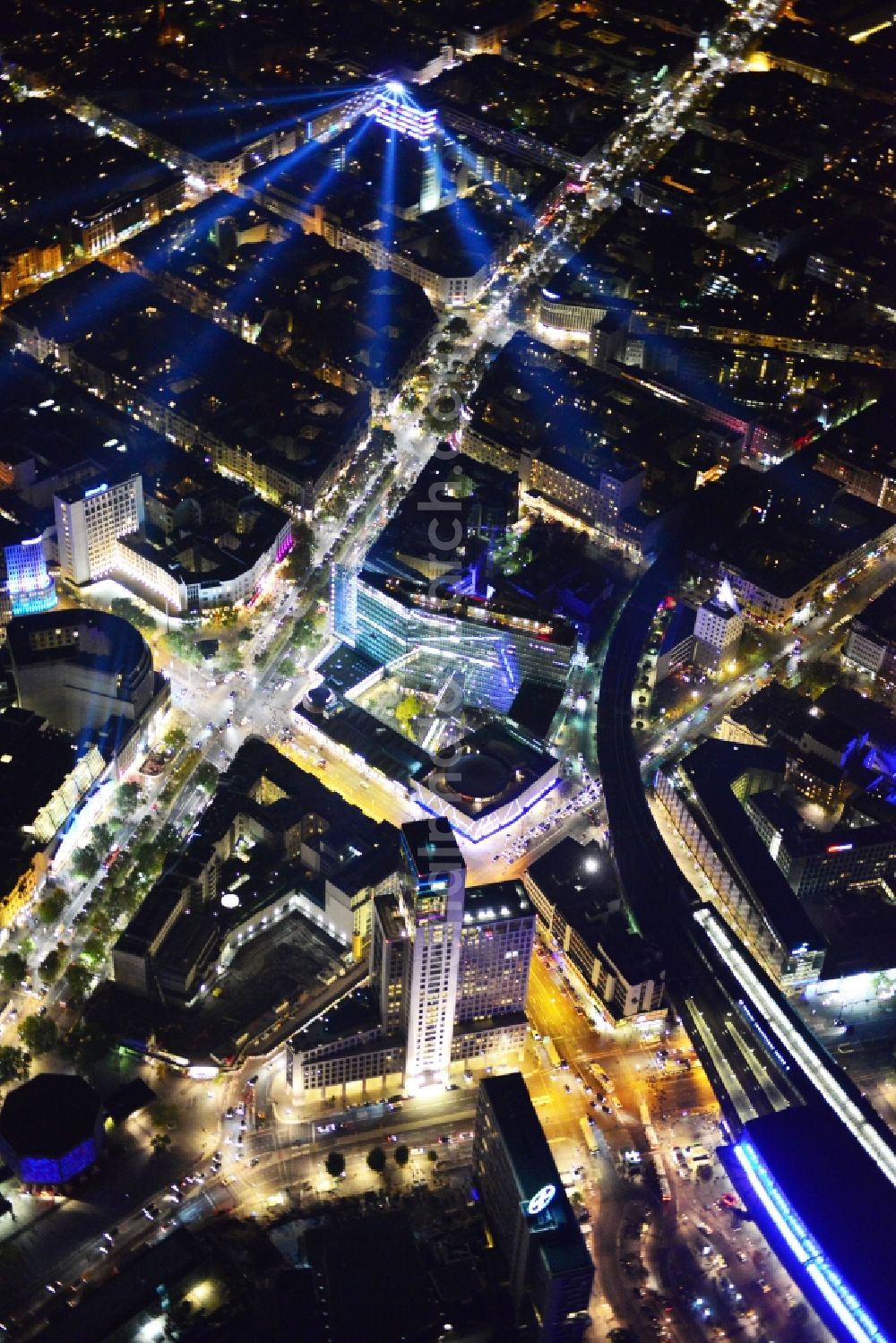 Berlin at night from above - Night aerial view of illuminated buildings in the City West during the Festival of Light in Berlin Charlottenburg. The impressive installations of the annual event immerse the commercial and residential space along the Kurfuerstendamm in colorful lights. Part of the attractions are among others the Neues Kranzler Eck and the KU DAMM Karree. Warning: Commercial use can only be realized upon prior request at euroluftbild.de!