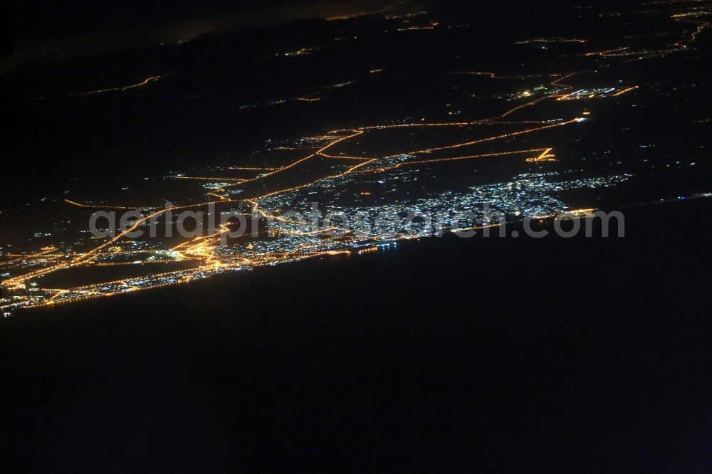 Ras Al-Khaimah at night from above - Night Aerial view of Ras Al Khaimah at the Persian Gulf in the United Arab Emirates