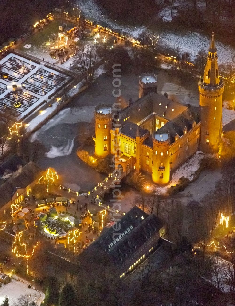 Bedburg-Hau at night from above - Night lighting building and castle park systems of water castle Moyland in the district Till-Moyland in Bedburg-Hau in the state North Rhine-Westphalia, Germany