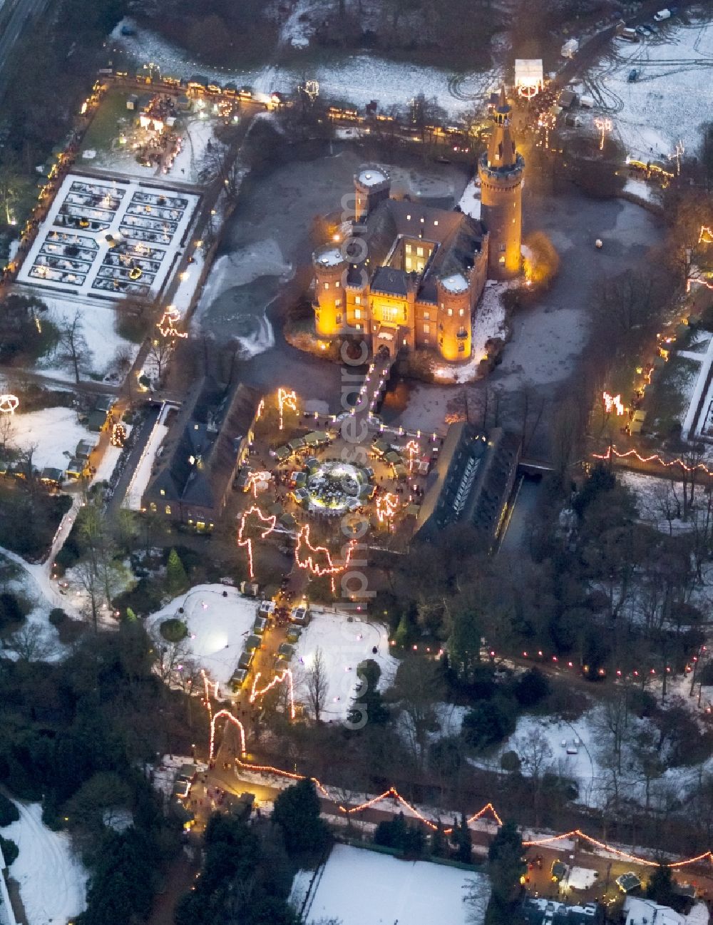 Bedburg-Hau at night from above - Night lighting building and castle park systems of water castle Moyland in the district Till-Moyland in Bedburg-Hau in the state North Rhine-Westphalia, Germany