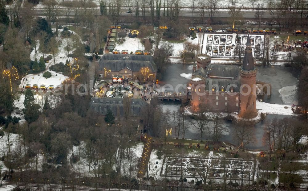 Bedburg-Hau at night from above - Night lighting building and castle park systems of water castle Moyland in the district Till-Moyland in Bedburg-Hau in the state North Rhine-Westphalia, Germany